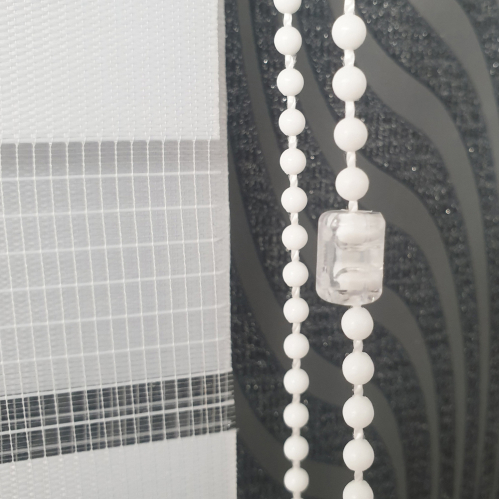 Connexion transparente de chaînette pour store enrouleur